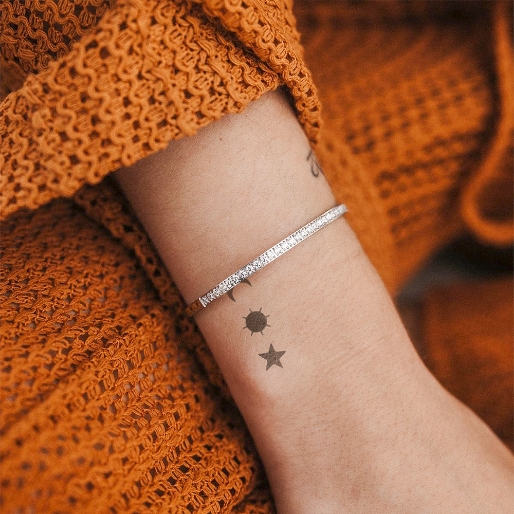 Moon, sun, star tattoo