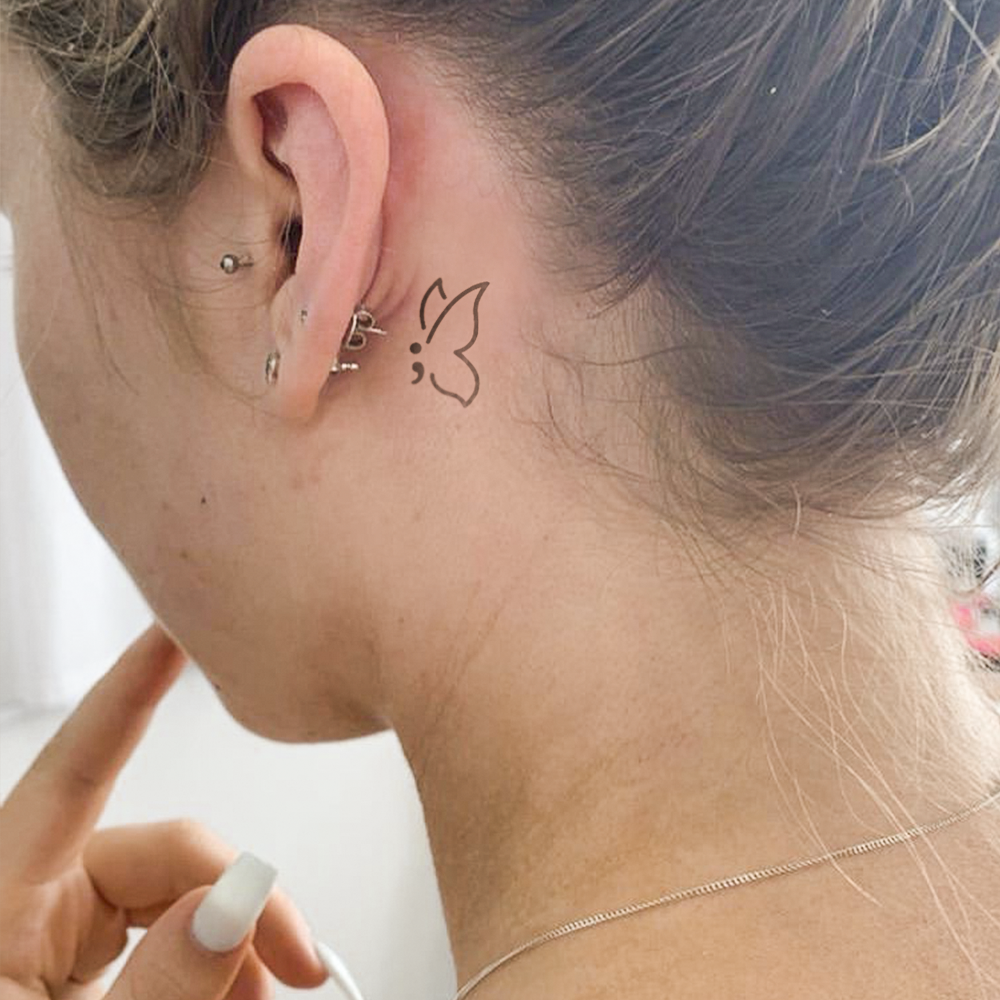 Butterfly semicolon tattoo