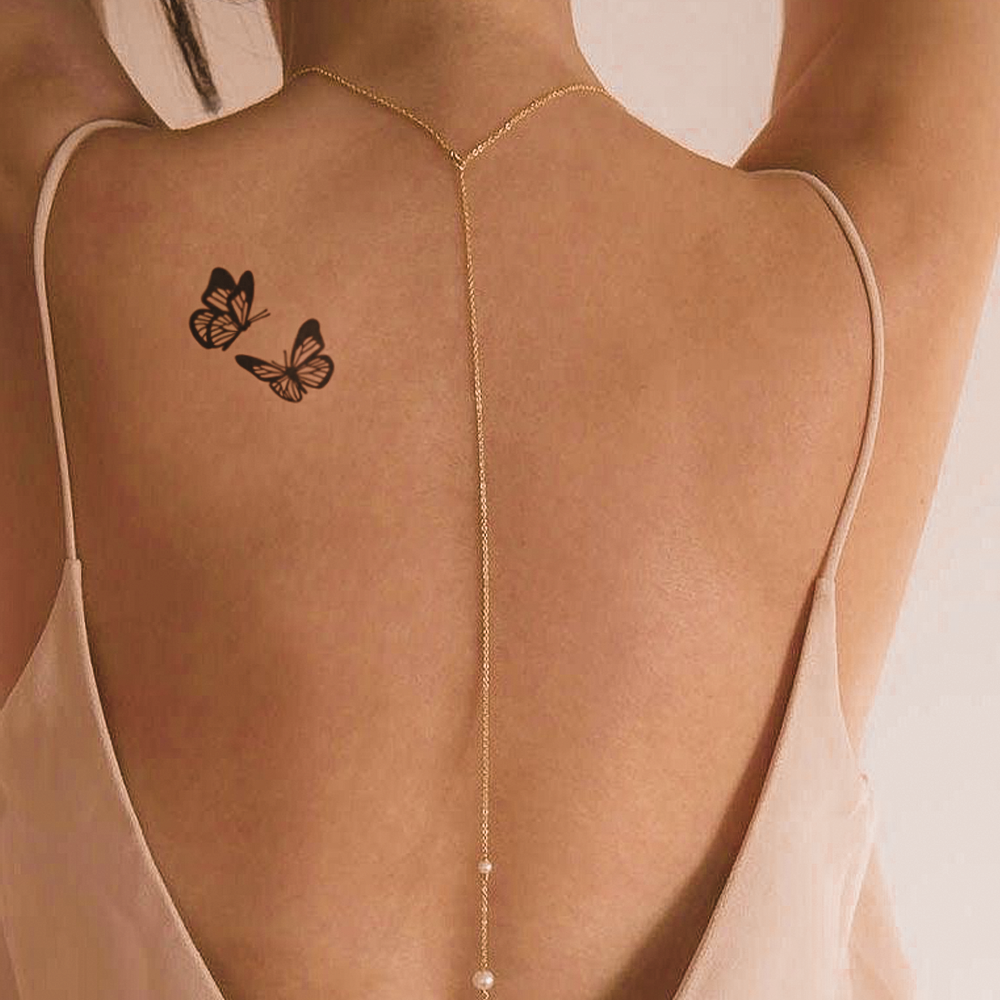 Tatuagem dupla de borboletas