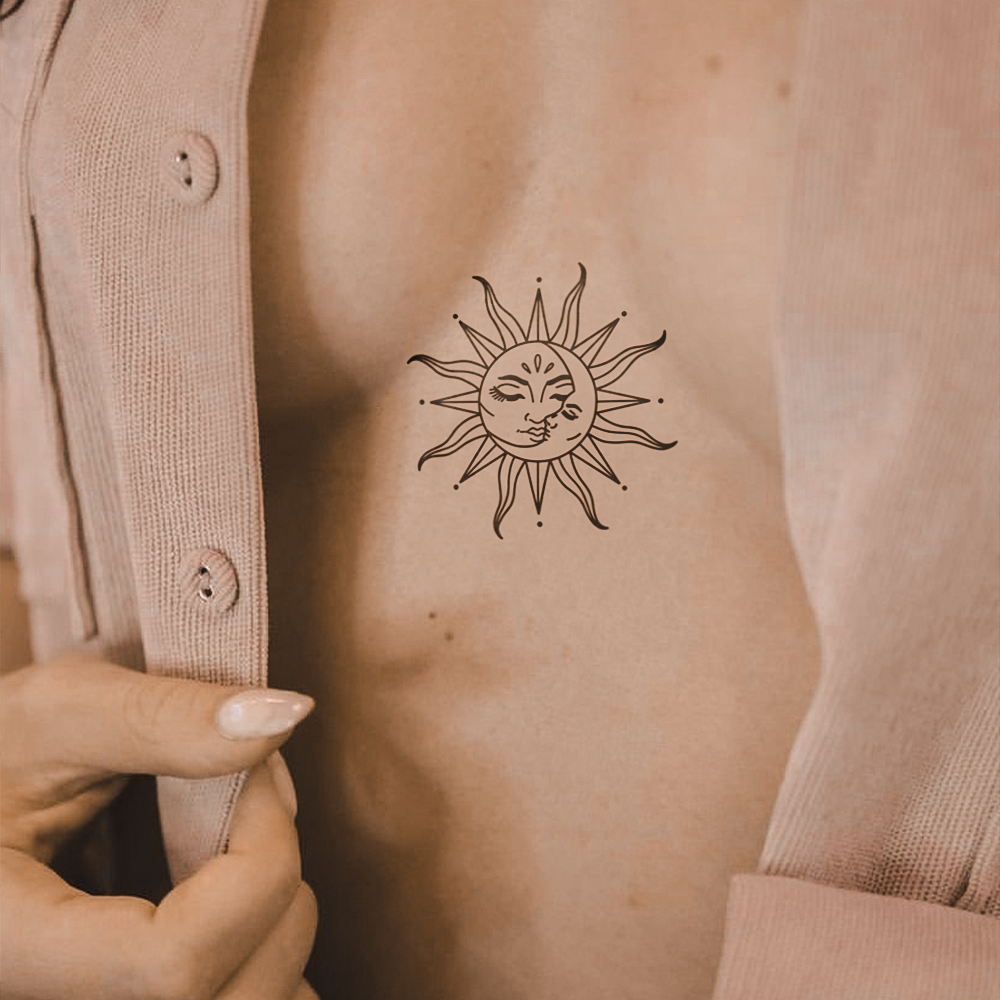 Sun and moon hug tattoo
