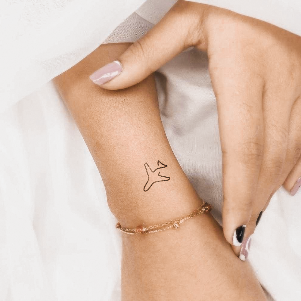 Airplane silhouette tattoo
