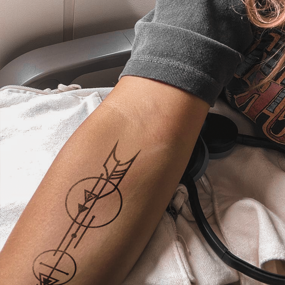 Arrows and circles tattoo