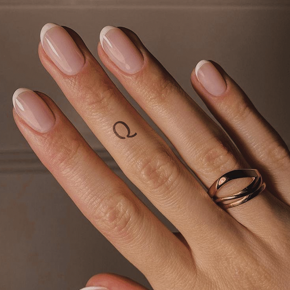Tatuagem Q