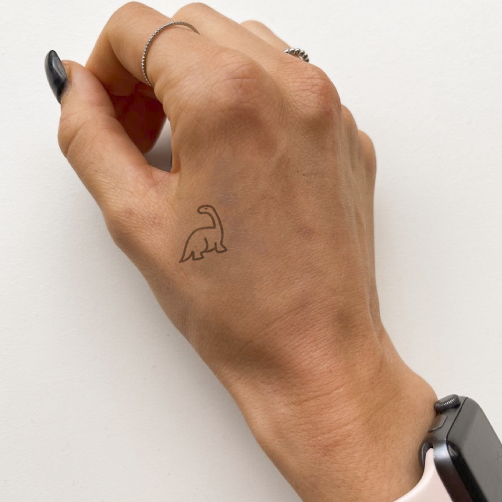 Tatuaje dinosaurio pequeño