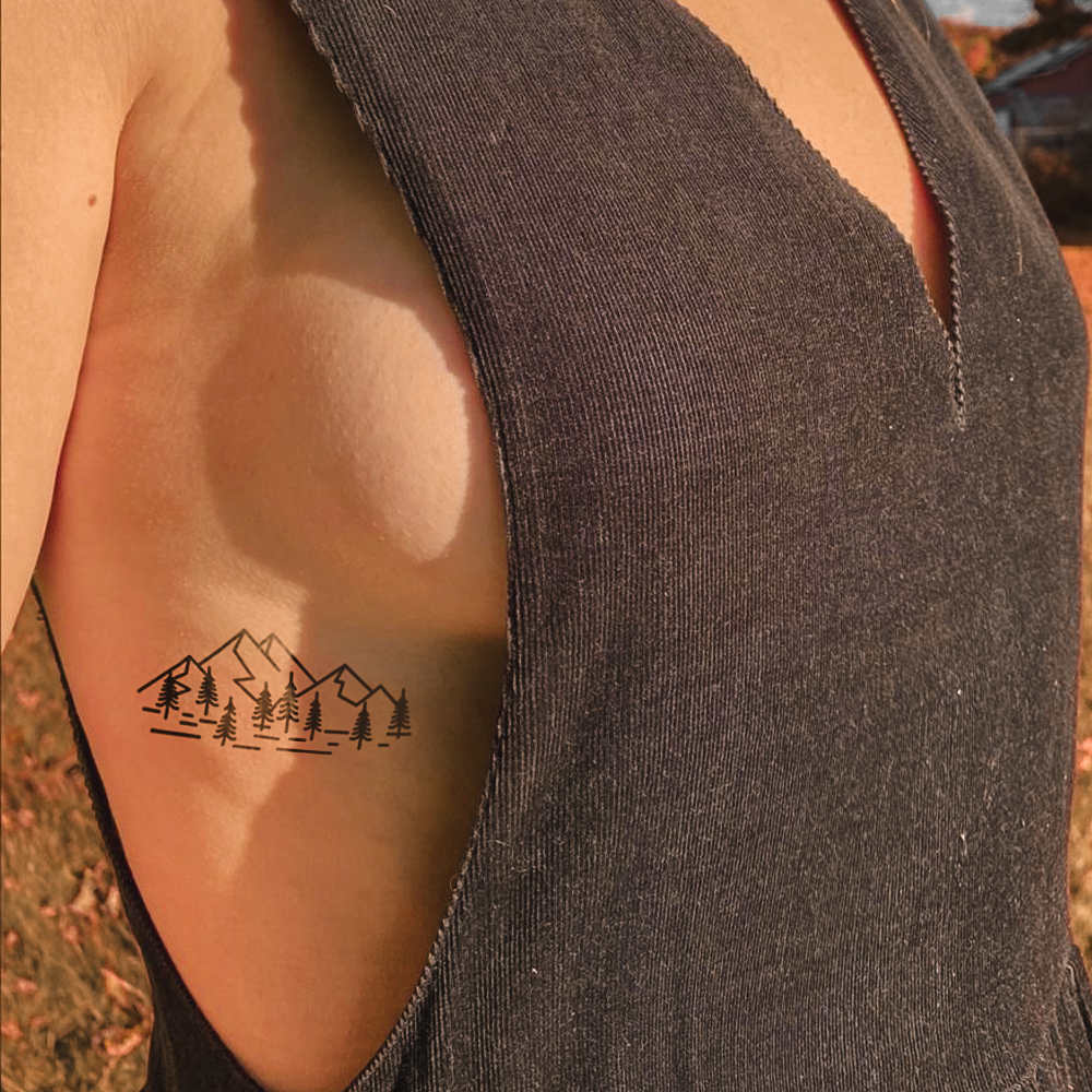 Mountains and trees tattoo