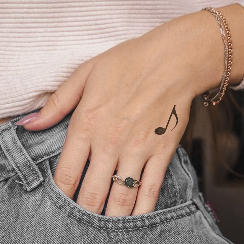 Musical note tattoo