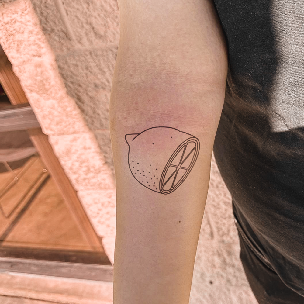 Half lemon tattoo