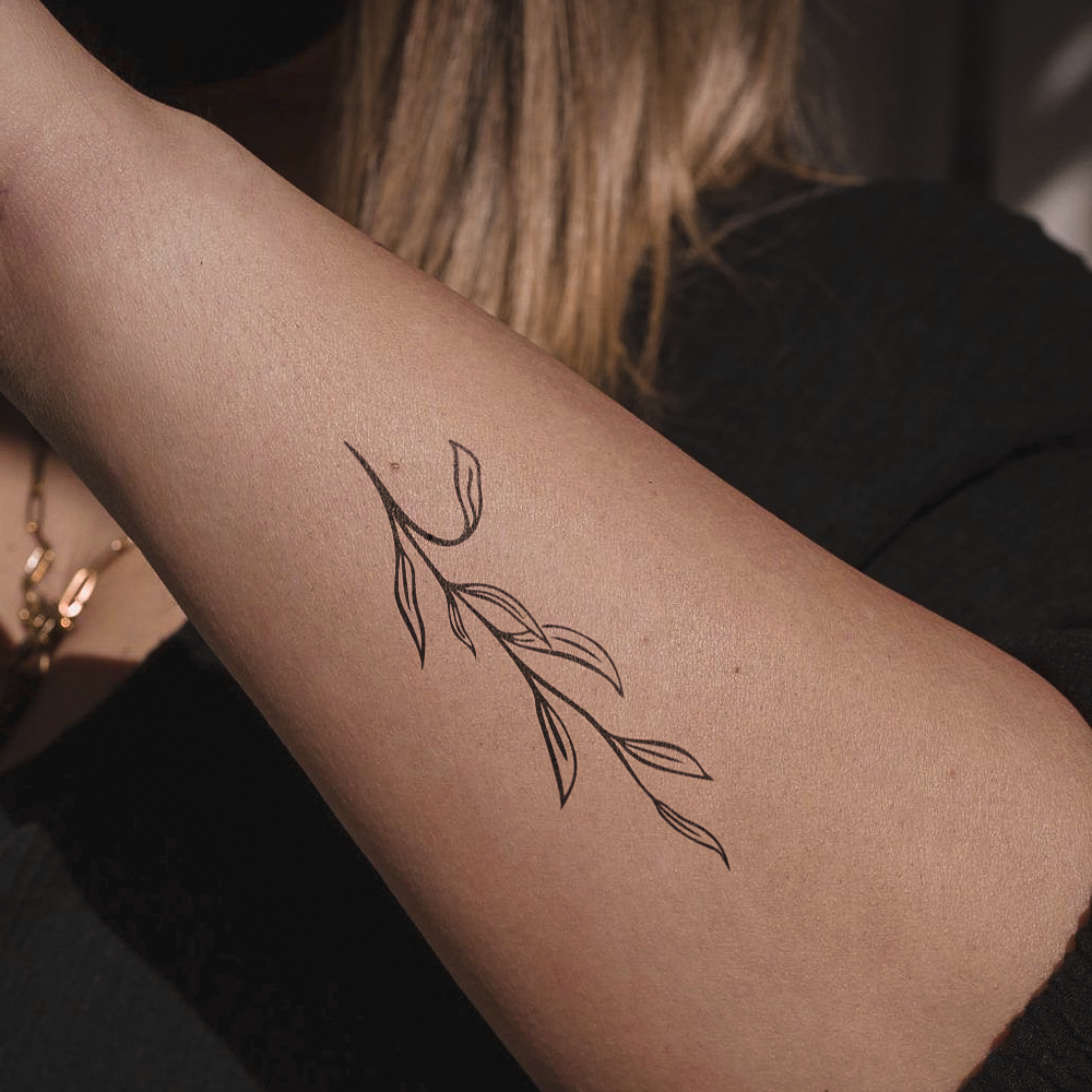 Branch with leaves tattoo