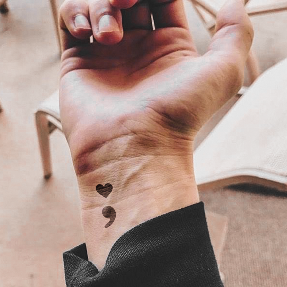 Heart and comma tattoo